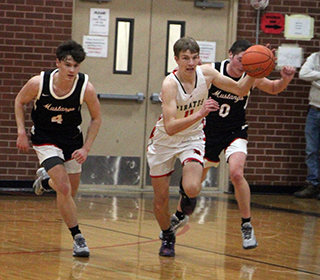 Briggs Rambo heads upcourt against Deary after stealing the ball.