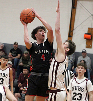 Riley Shears puts up a shot in the lane at Kamiah.