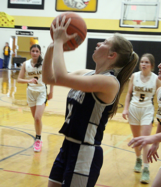 Julia Wassmuth puts up a shot in the District game at Highland.