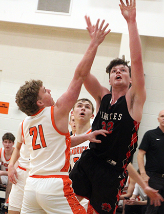 Nate Forsmann goes for a lay-up at Kendrick.