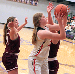 Sage Elven goes for 2 of her game-high 20 points against Kamiah.