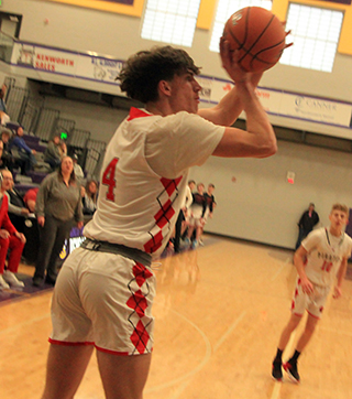 Riley Shears puts up a shot from the baseline against C.V. at District. Also shown is Phil Schwartz.