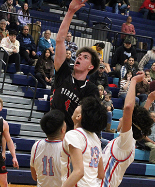 Riley Shears goes for a lay-up against Lapwai at District. He had a team high 24 points in the double overtime loss.