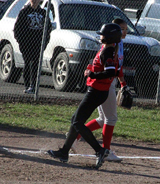 Zoey Behler pulls into third against Lapwai. The freshman had 3 singles and a double in the game.