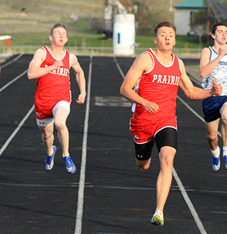 Trenton Lorentz, right, and Dylan Uhlenkott finished 1-2 in the 200 meter dash at the Prairie Meet April 23. They also teamed with Noah Geis and Ben Secrest to break the school record in the 4x200.