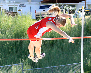 Sierra Oliver clears 9 feet for a new school record in the girls pole vault at the Meet of Champions.