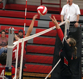 Ellie Nuxoll goes for a block at C.V.