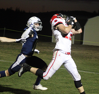 Matt Wemhoff catches a pass for the game’s first touchdown at Logos.