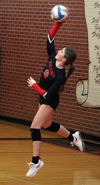 Aubree Rehder jump serving on Senior Night against C.V.