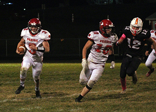 Dylan Uhlenkott follows lead blocker Chris Schumacher on a sweep to the right.