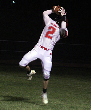 Levi Gehring makes a leaping catch in the end zone for a touchdown.