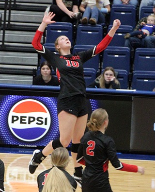 Kylie Schumacher goes up for a spike against Potlatch at District