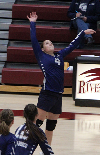 Sarah Waters goes up for a spike against Rockland at state volleyball.