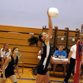 Tiffany Schaeffer reaches high for a spike.