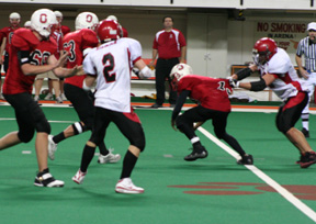 Kyler Shumway got a fistful of jersey of Oakley quarterback Stephan Ortiz and sacked the elusive runner for a big loss. Conner Rieman is at left.