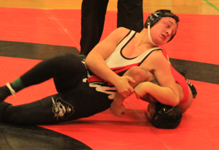 In what amounted to the championship match in his class, Garrett Schmidt grapples with a White Swan wrestler.