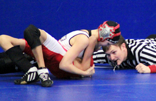 Kellie Heitman is about to  score a pin in an early round match at the Pomeroy Tournament.