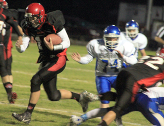 Brandon Anderson, right, takes out a defender allowing Jake Bruner room to run.