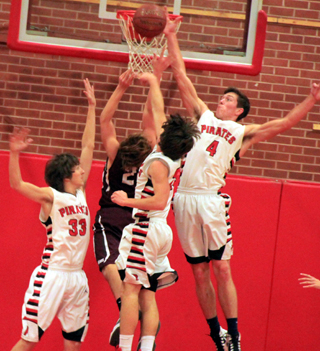 Patrick Chmelik blocks a Kamiah shot as Anthony Karel and Brandon Anderson also surround the Kamiah player.