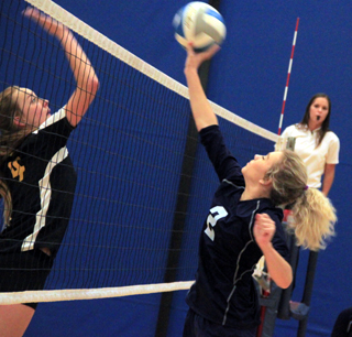 Hailey Stubbers looks to tip the ball past a Highland defender.