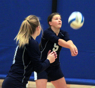 Taylor Lustig makes a pass in Summits match against Deary at District as Lexi Currier watches.