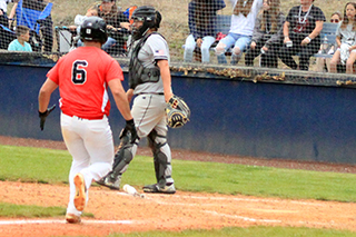 Brody Hasselstrom is about to score the game-winning run against Horseshoe Bend.