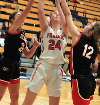 Alli Geis puts a shot up against Clarkston.