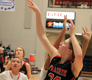 Kylie Schumacher shoots against Lapwai. Also shown is Tara Schlader.