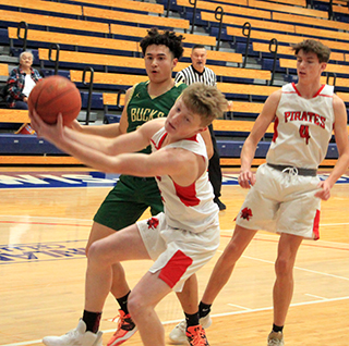 Matt Wemhoff pulls down an offensive rebound against Pendleton. Also shown is Riley Shears.