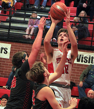 Lee Forsmann shoots for 2 of his 33 points against C.V. last Tuesday, Jan. 10.