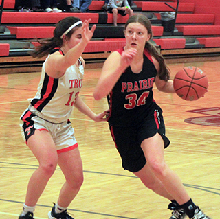 Kylie Schumacher drives past a Troy defender.