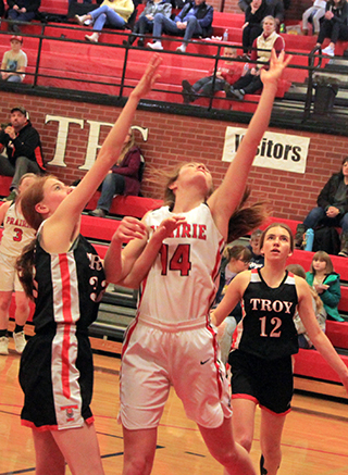 Tara Schlader puts up a shot against Troy. Kristin Wemhoff can be seen in the background.