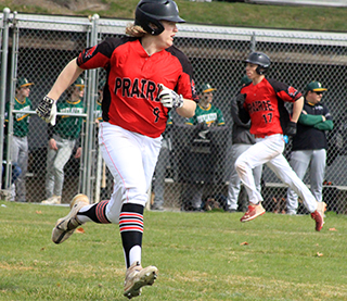 Noah Behler heads to first with a single against Potlatch as Colton McElroy can be seen heading home from third.