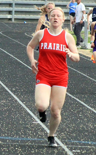 Kristin Wemhoff nears the finish line in the 400 meter dash where she broke the school record.