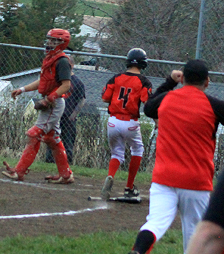 Phil Schwartz scores the winning run in the 8th inning as you can see Coach David Shears starting to celebrate.