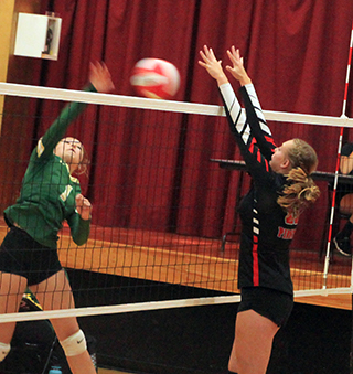 Alli Geis blocked this spike attempt by Potlatch.