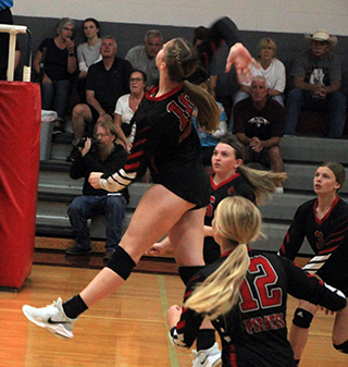 Kylie Schumacher goes up for a spike at Kamiah.