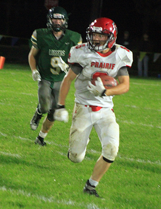 Levi Gehring carries the ball at Potlatch.