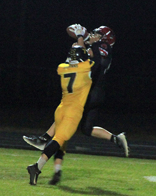 Levi Gehring makes a catch despite the hands in his face from a Timberline defender. He wound up catching 7 passes in the game, 4 from Prairie quarterback Noah Behler and 3 from Timberline’s quarterback while playing defense.