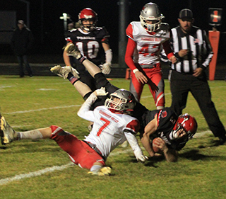 Dylan Uhlenkott dives across the goal line for one of his 2 touchdowns.