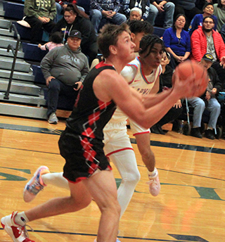 Trenton Lorentz goes for a lay-up at Lapwai.