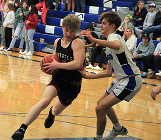 Matt Wemhoff drives past an Orofino defender.