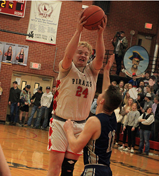 Noah Behler pulls down a rebound in the Logos game.