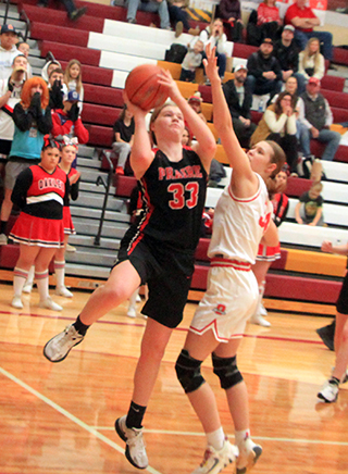 Sage Elven scores 2 of her 20 points against Oakley in the third place game. She scored 56 points in the 3 games at State.