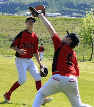 Collin Ray makes a backhanded catch as Phil Schwartz looks on in the first Troy game.