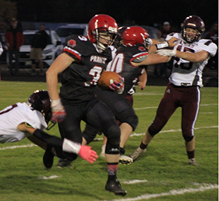 Dylan Uhlenkott stepped out of a possible tackle and went on to complete a 50-yard touchdown run. Blocking at right is Chris Schumacher.