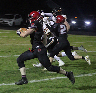 Prairie’s one offensive outburst against Kendrick was this 45 yard run for a touchdown by Dylan Uhlenkott. Also shown is Levi Gehring.