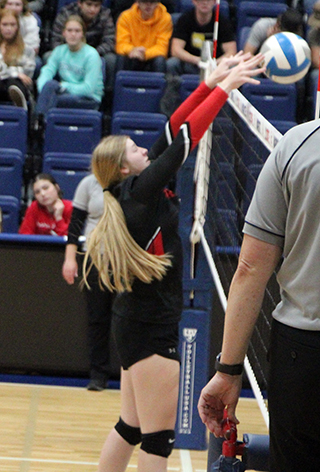 Hailey Hanson makes a block against C.V.