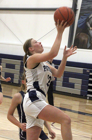 Julia Wassmuth goes for a lay-up against Logos. She scored 10 in the fourth quarter as the Patriots rallied to win.