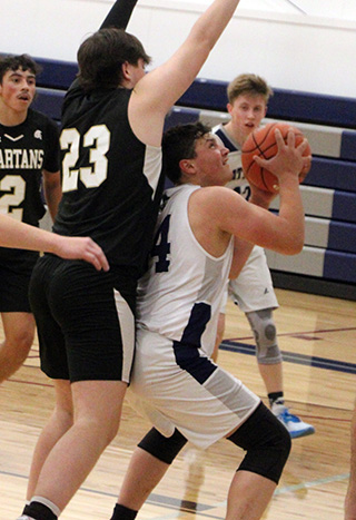 Connor Nuxoll looks to shoot against Timberline.